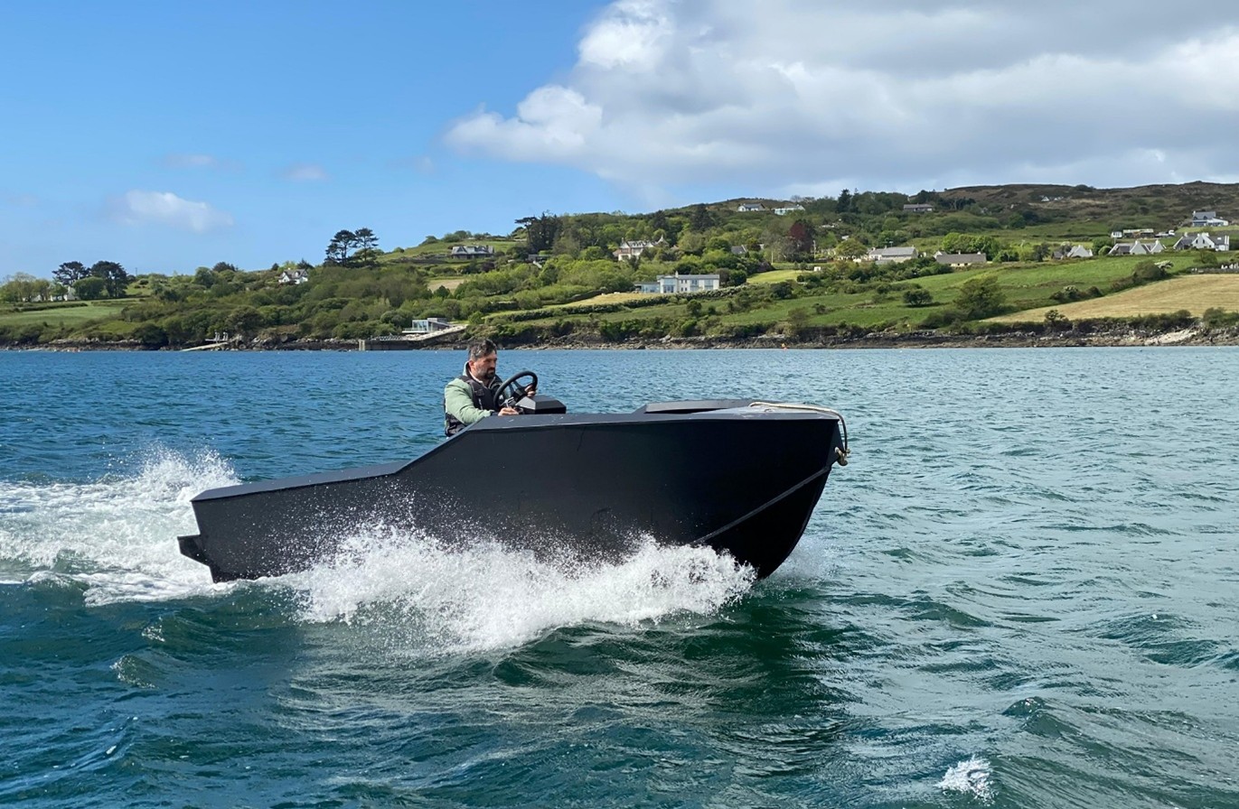 Teal five-meter electric craft